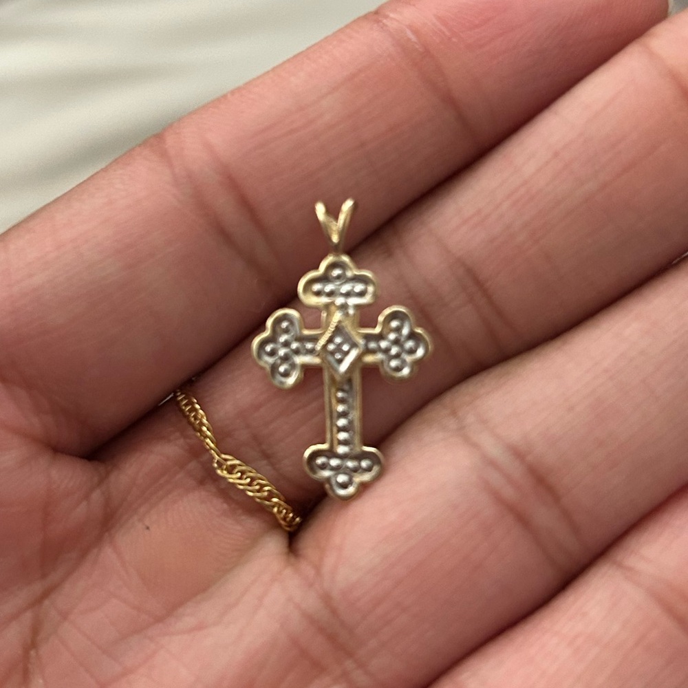 Elegant Gold and Silver Cross Pendant